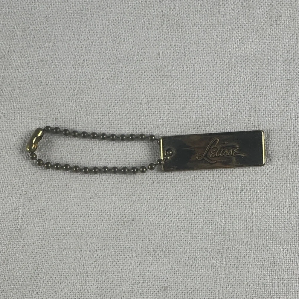 Letisse double sided gold bag charm tag